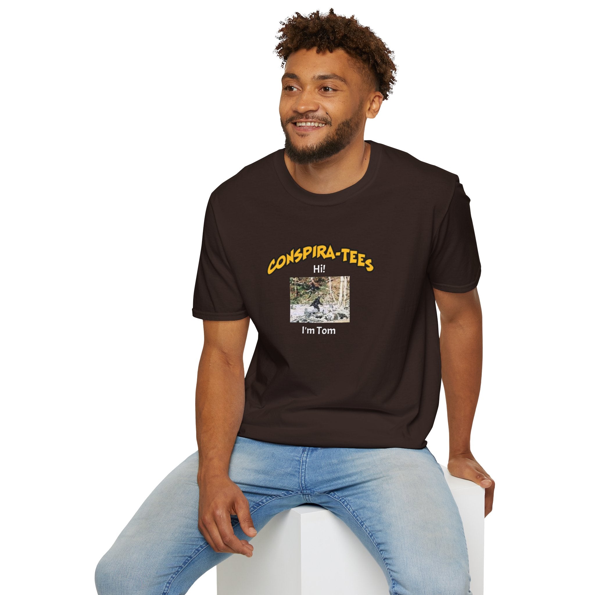 Bigfoot. “Hi I’m Tom,” Conspira-tee. Bigfoot is described as a massive, bipedal ape standing 6 to 10 feet tall, covered in thick hair, and roaming the remote forests of the US Pacific Northwest.