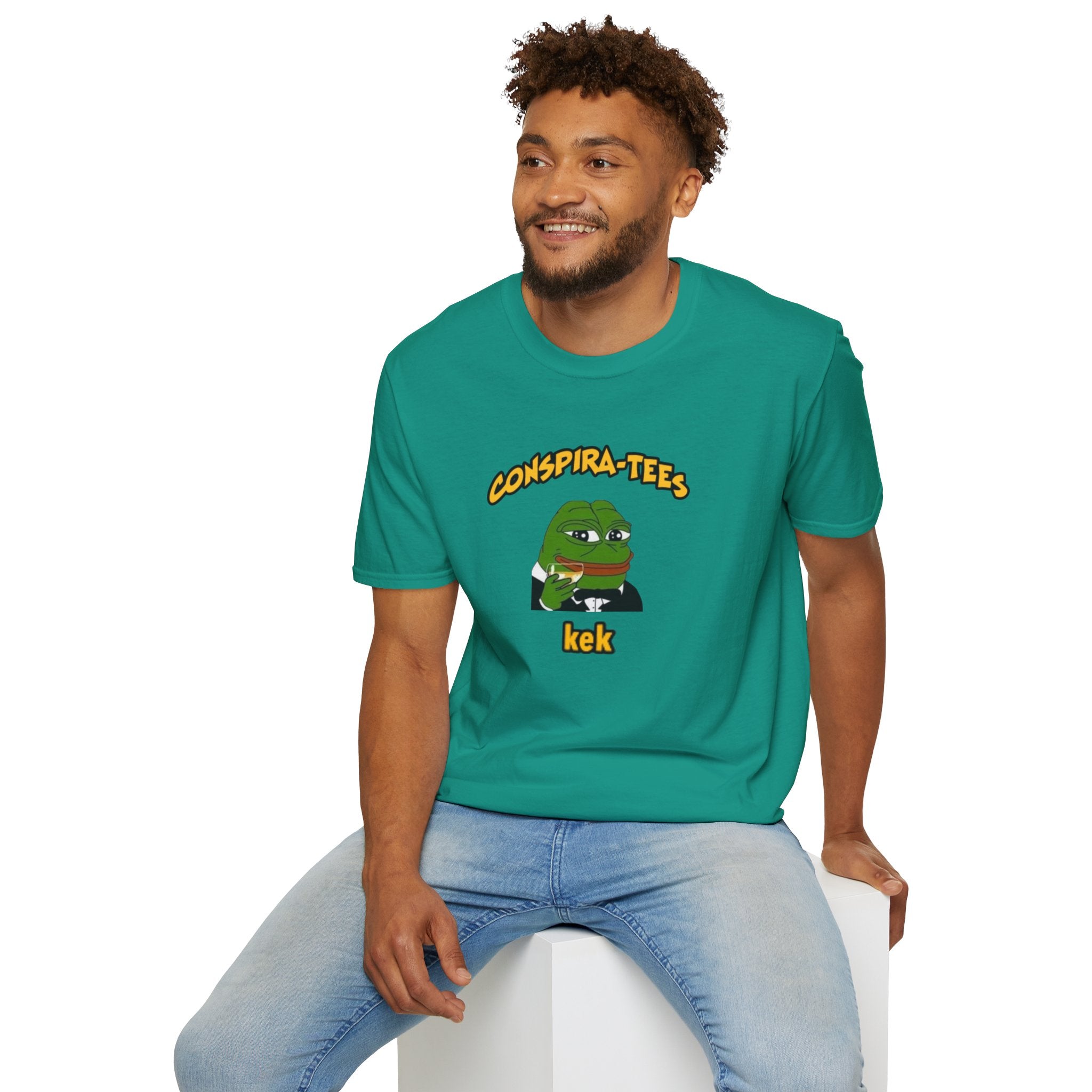 Kek Conspira-tee. Pepe at one point in time was the face of conspiracy memes on 4 chan and 8 chan. Kek is netspeak for lol. Mocking your enemy.
