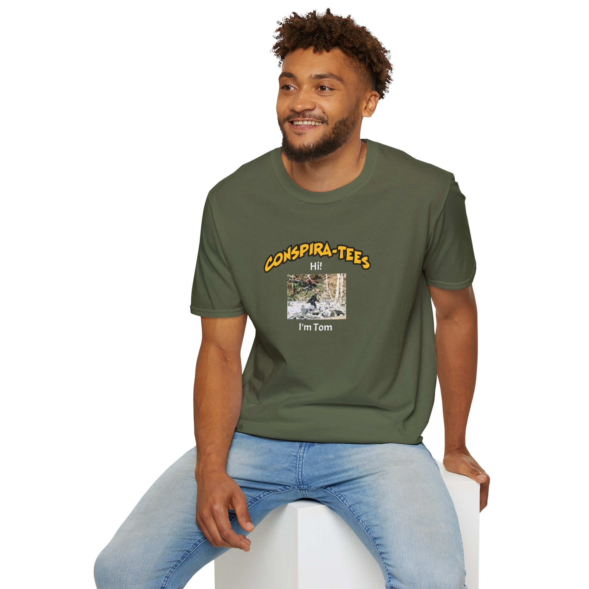 Bigfoot. “Hi I’m Tom,” Conspira-tee. Bigfoot is described as a massive, bipedal ape standing 6 to 10 feet tall, covered in thick hair, and roaming the remote forests of the US Pacific Northwest.