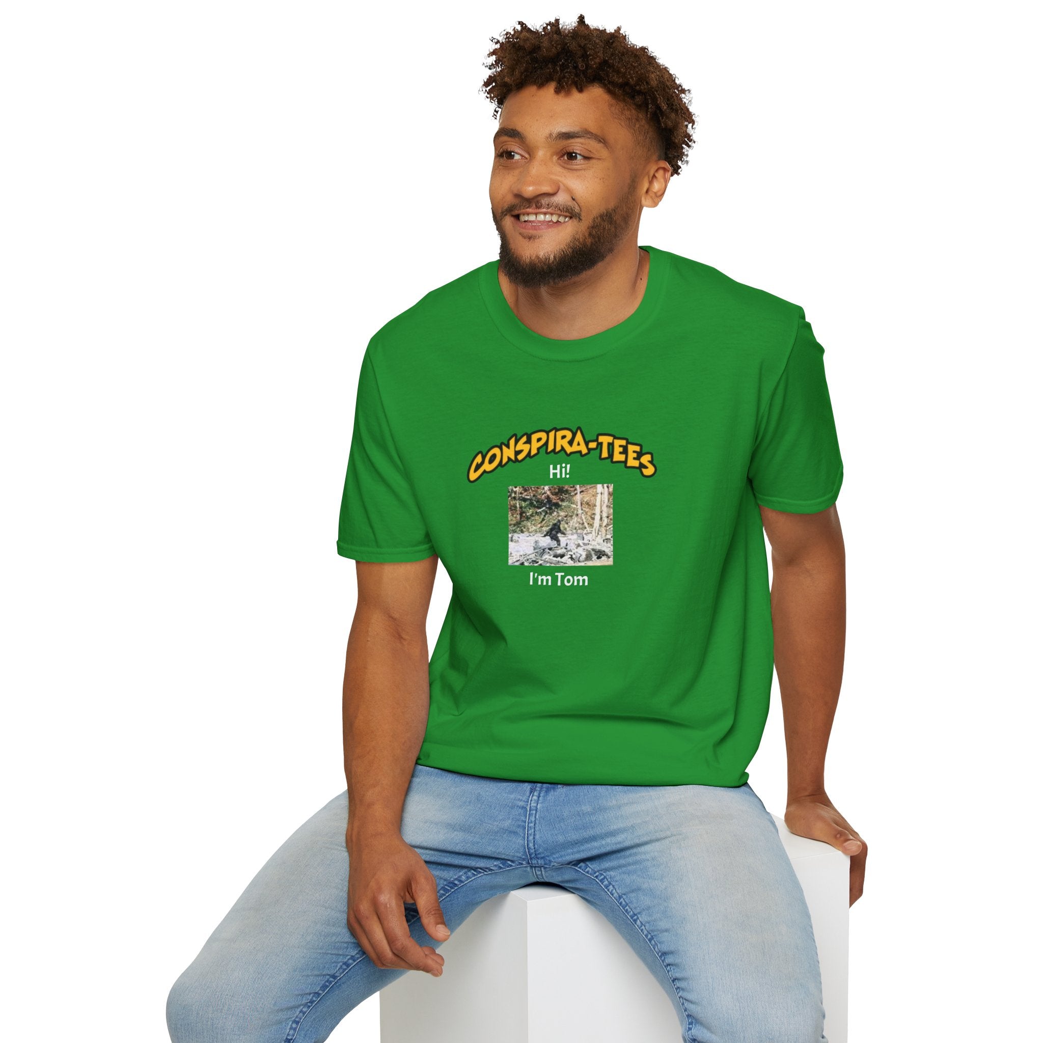 Bigfoot. “Hi I’m Tom,” Conspira-tee. Bigfoot is described as a massive, bipedal ape standing 6 to 10 feet tall, covered in thick hair, and roaming the remote forests of the US Pacific Northwest.