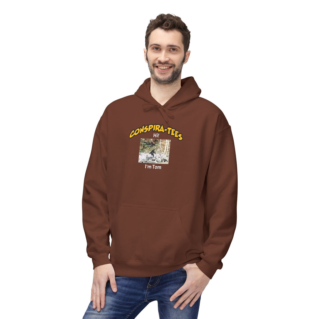 Bigfoot. “Hi I’m Tom,” Conspira-tee. Bigfoot is described as a massive, bipedal ape standing 6 to 10 feet tall, covered in thick hair, and roaming the remote forests of the US Pacific Northwest.