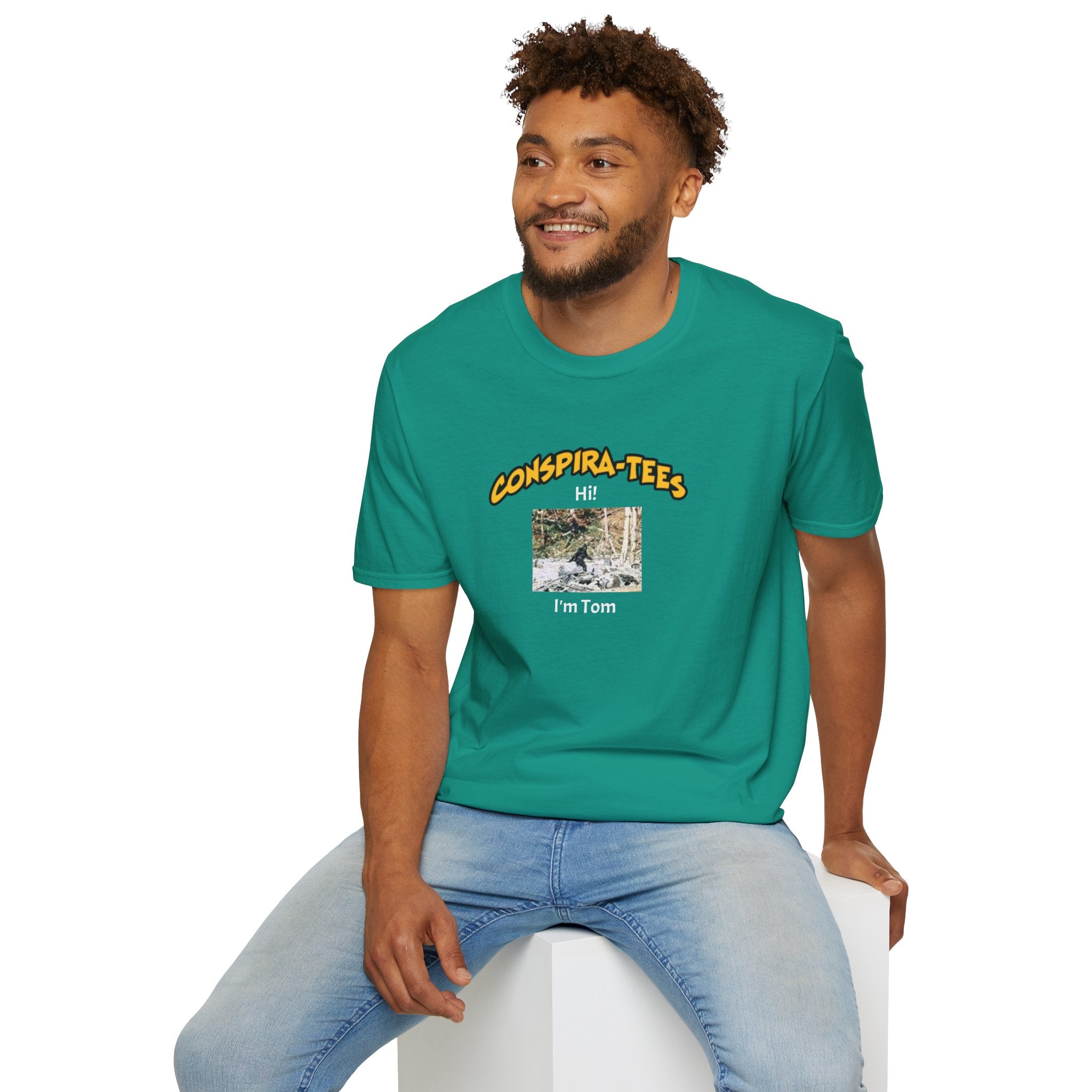 Bigfoot. “Hi I’m Tom,” Conspira-tee. Bigfoot is described as a massive, bipedal ape standing 6 to 10 feet tall, covered in thick hair, and roaming the remote forests of the US Pacific Northwest.