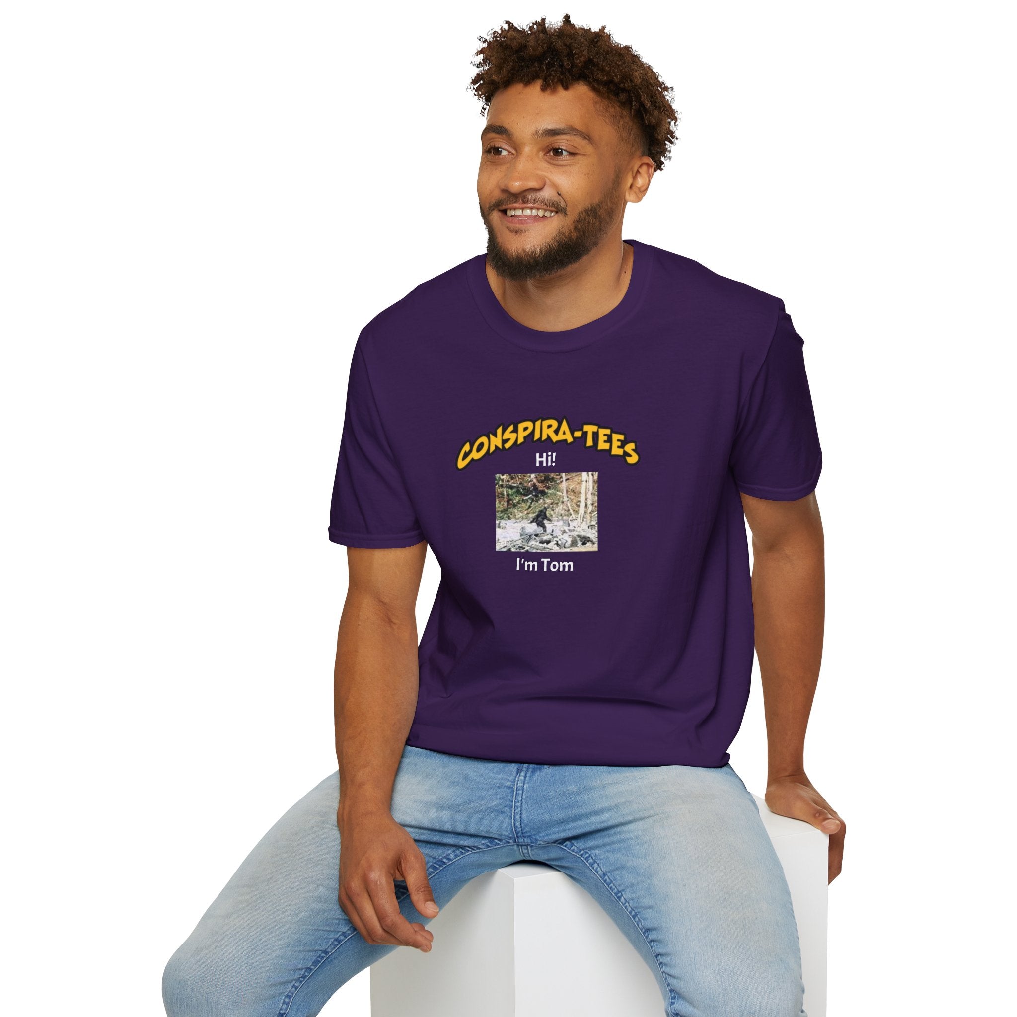 Bigfoot. “Hi I’m Tom,” Conspira-tee. Bigfoot is described as a massive, bipedal ape standing 6 to 10 feet tall, covered in thick hair, and roaming the remote forests of the US Pacific Northwest.
